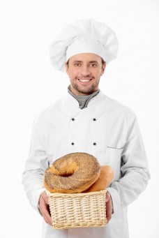 糕抱着面包篮筐的厨师图片